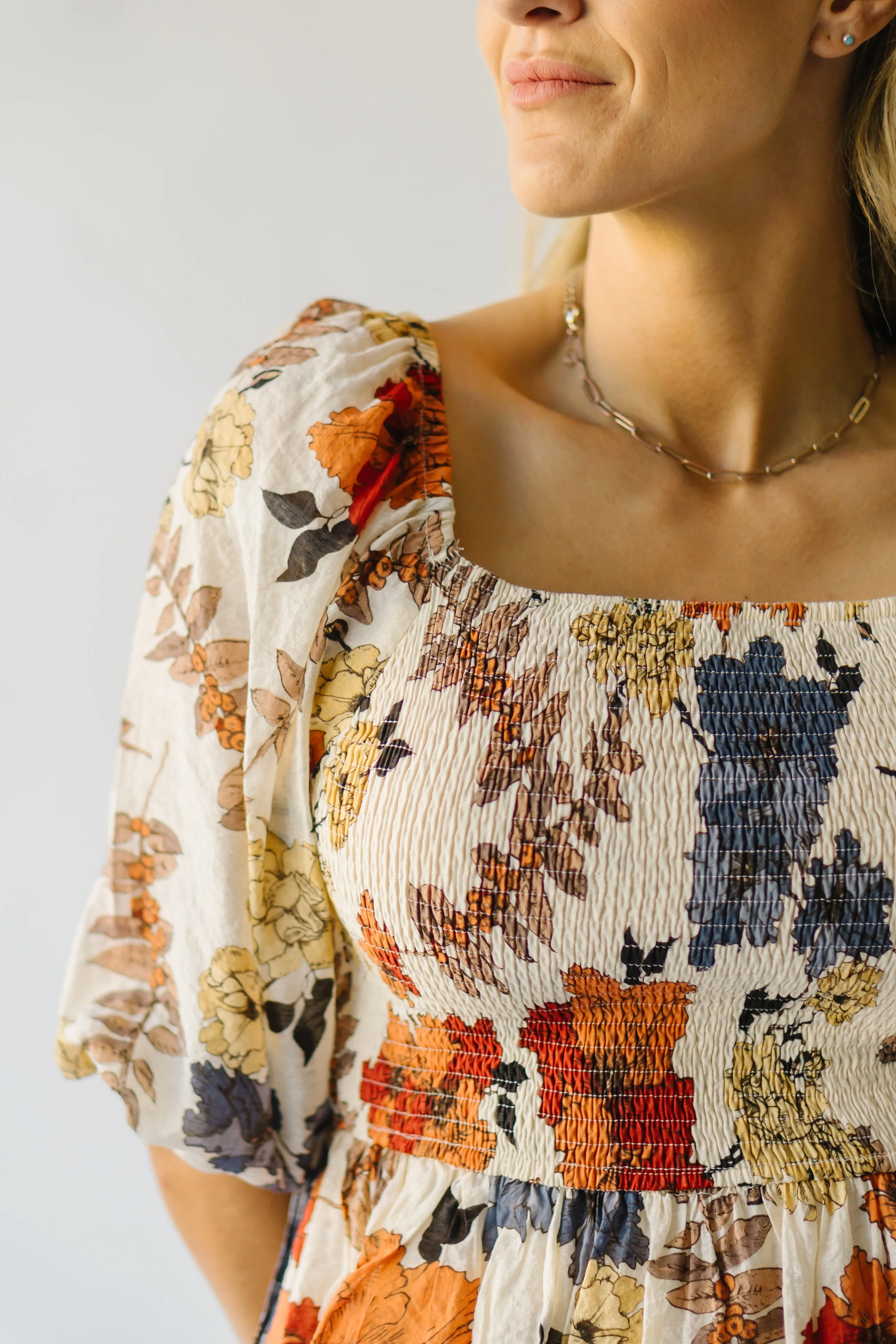 The Ashbelle Smocked Peplum in Rust Multi